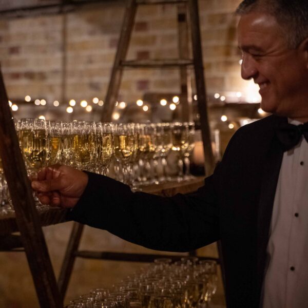 Guest reaching for a glass of Champagne 